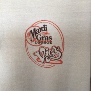 Stedman - Men's tan polo shirt for Vic's Mardi Gras Lounge